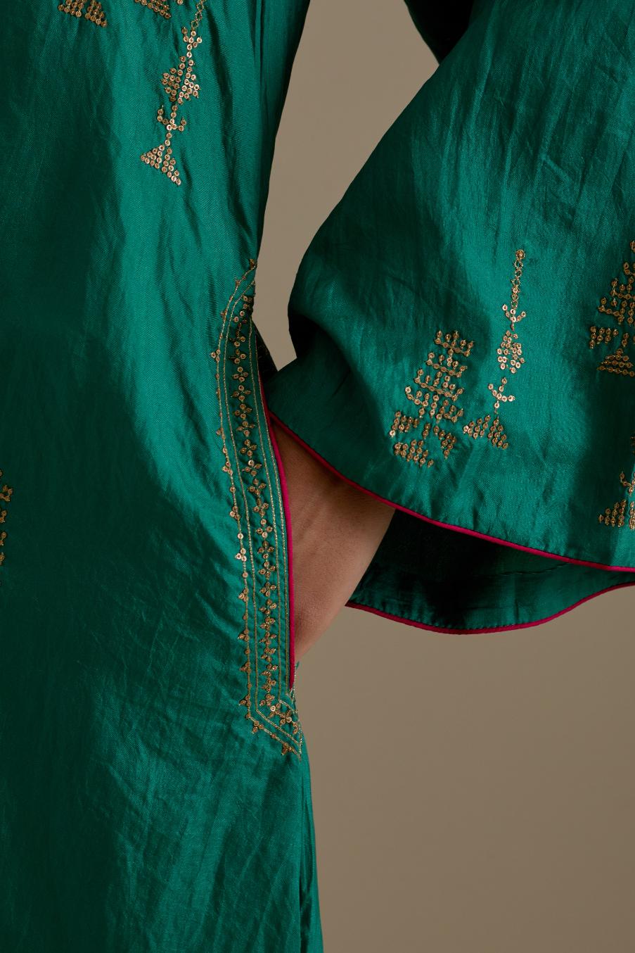 Persian green silk A-line short kurta set, highlighted with dull gold zari and sequins handwork.