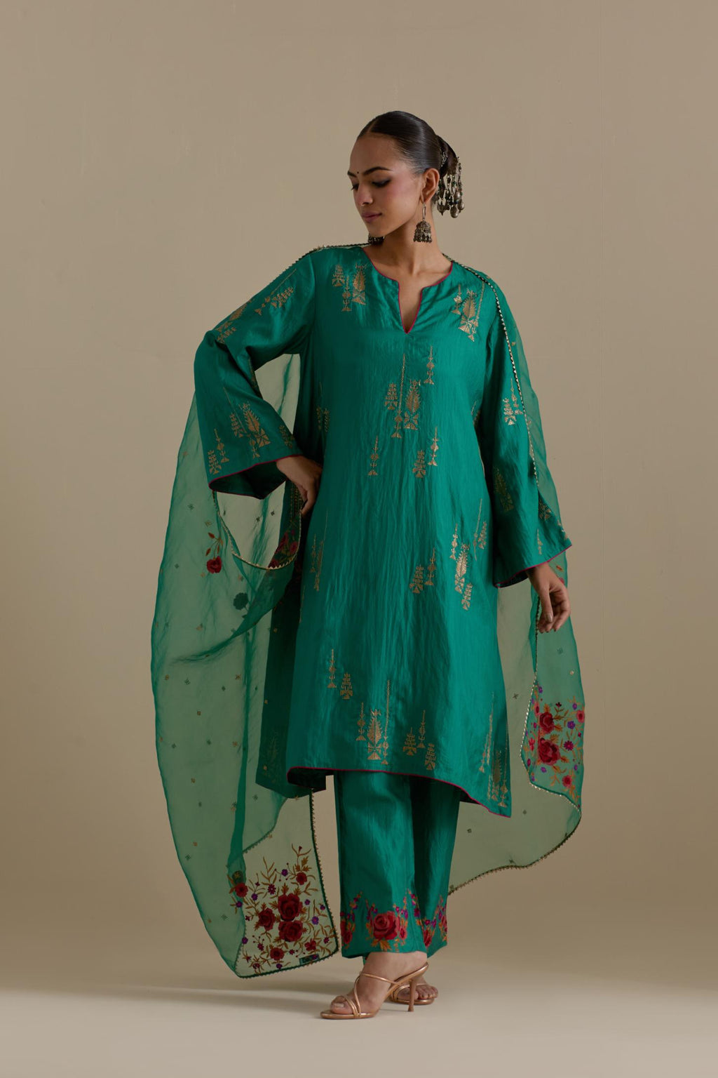 Persian green silk A-line short kurta set, highlighted with dull gold zari and sequins handwork.