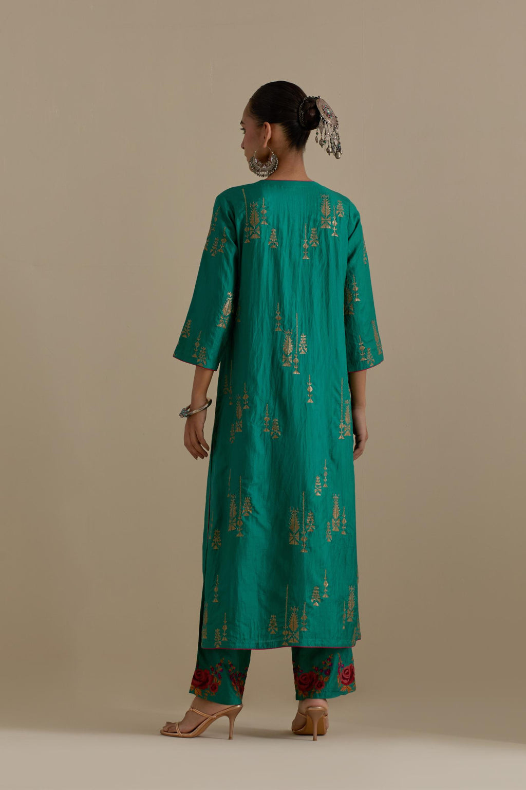 Persian green silk straight kurta set, highlighted with dull gold zari and sequins handwork.