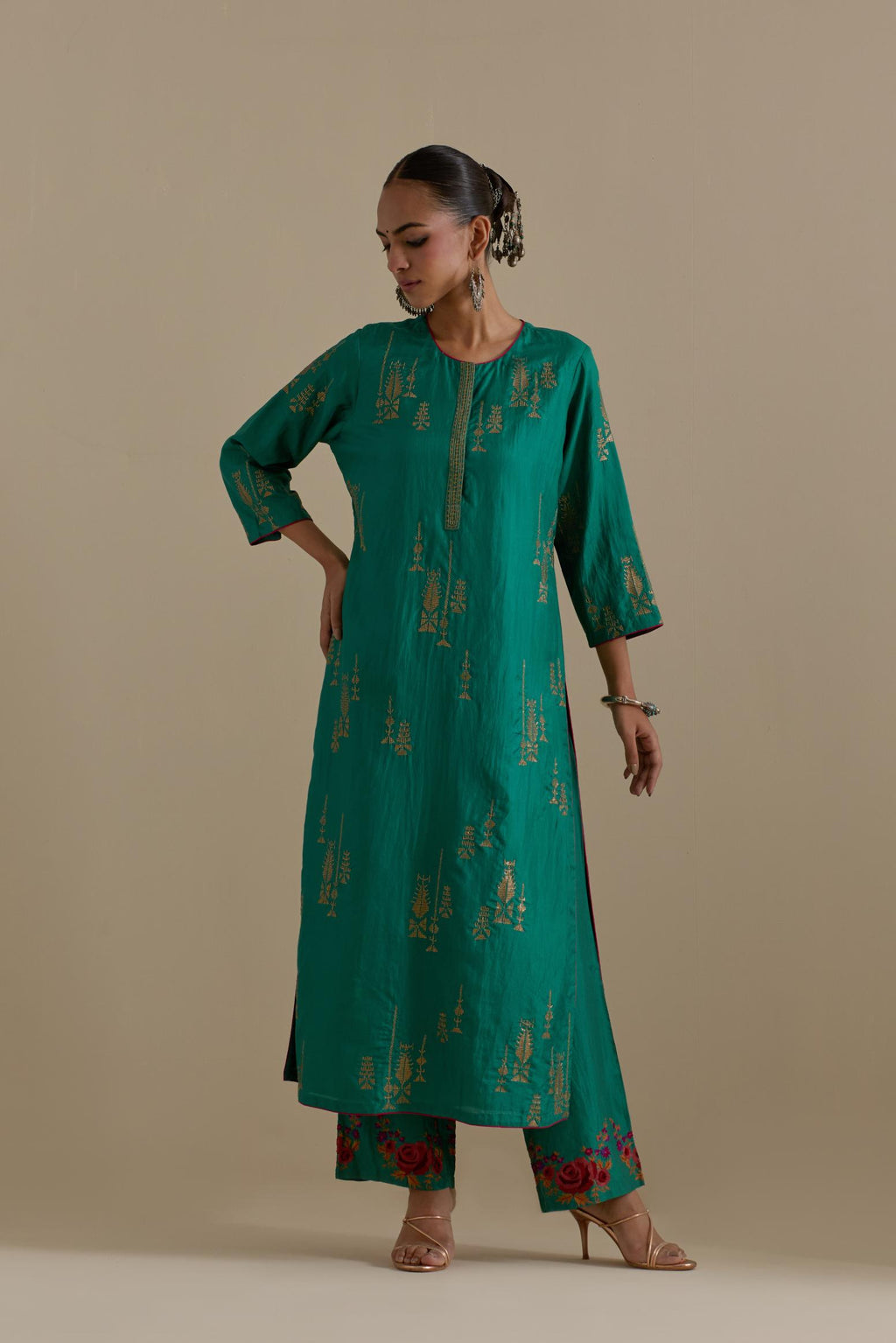 Persian green silk straight kurta set, highlighted with dull gold zari and sequins handwork.