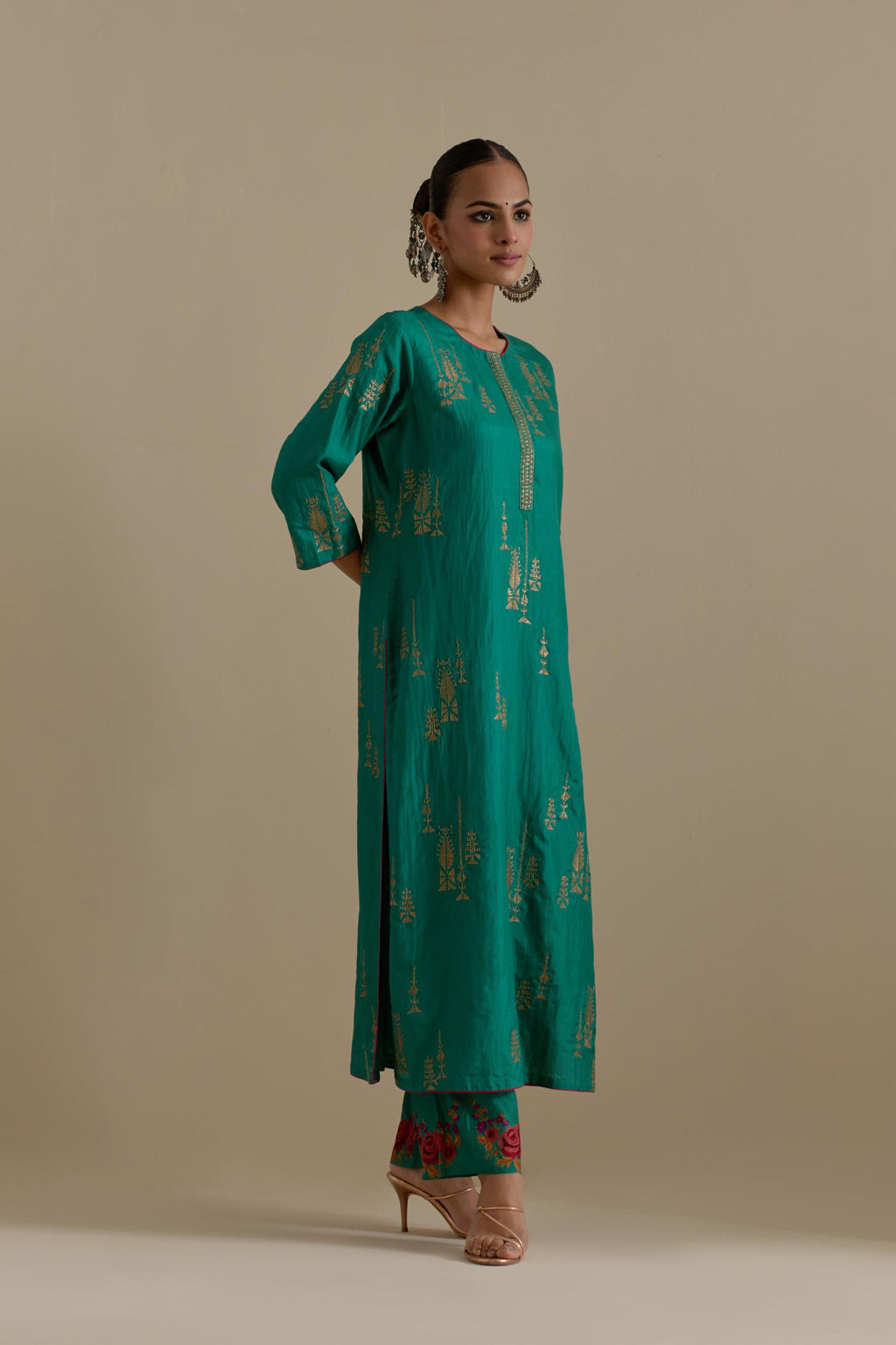 Persian green silk straight kurta set, highlighted with dull gold zari and sequins handwork.