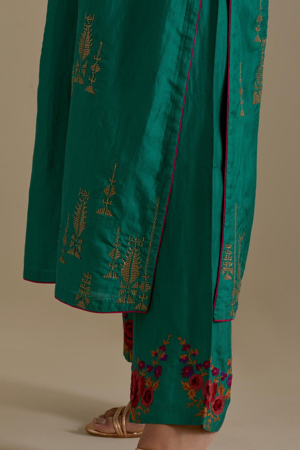 Persian green silk straight kurta set, highlighted with dull gold zari and sequins handwork.