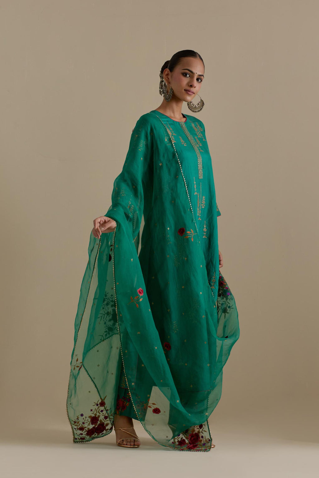 Persian green silk straight kurta set, highlighted with dull gold zari and sequins handwork.