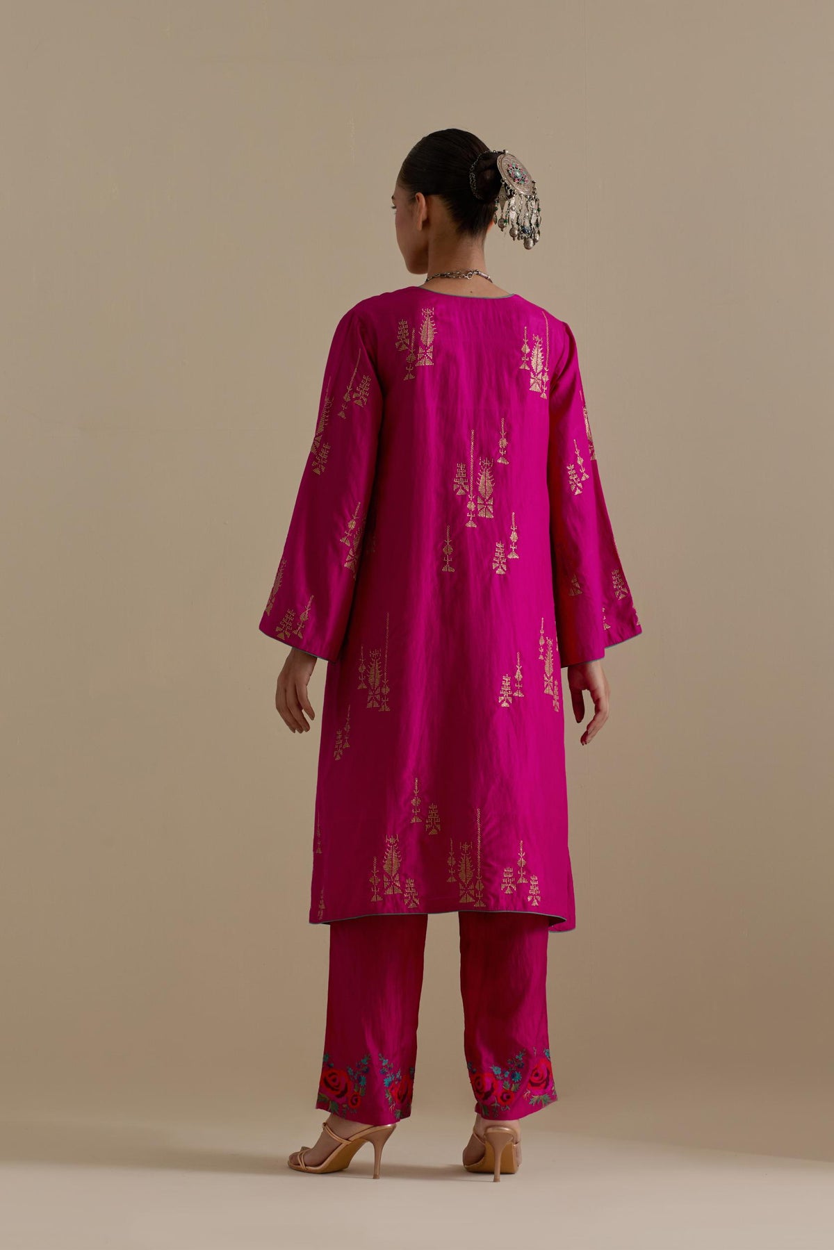 Fuchsia silk A-line short kurta set, highlighted with dull gold zari and sequins handwork.