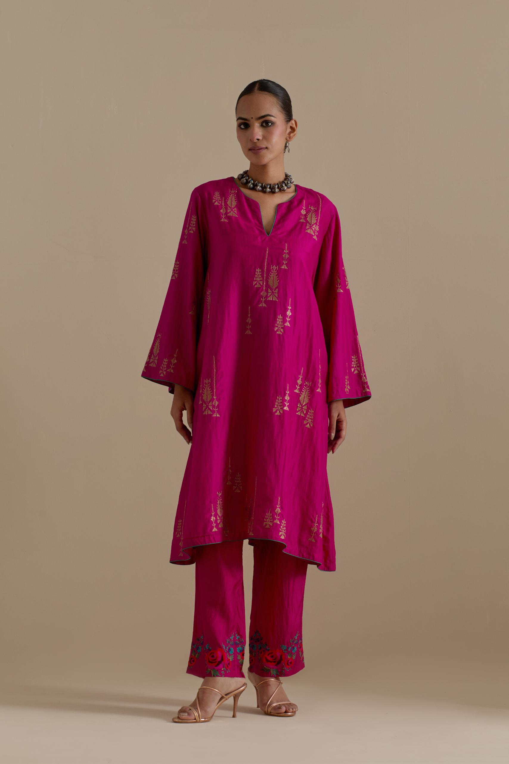 Fuchsia silk A-line short kurta set, highlighted with dull gold zari and sequins handwork.