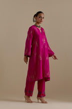Fuchsia silk A-line short kurta set, highlighted with dull gold zari and sequins handwork.