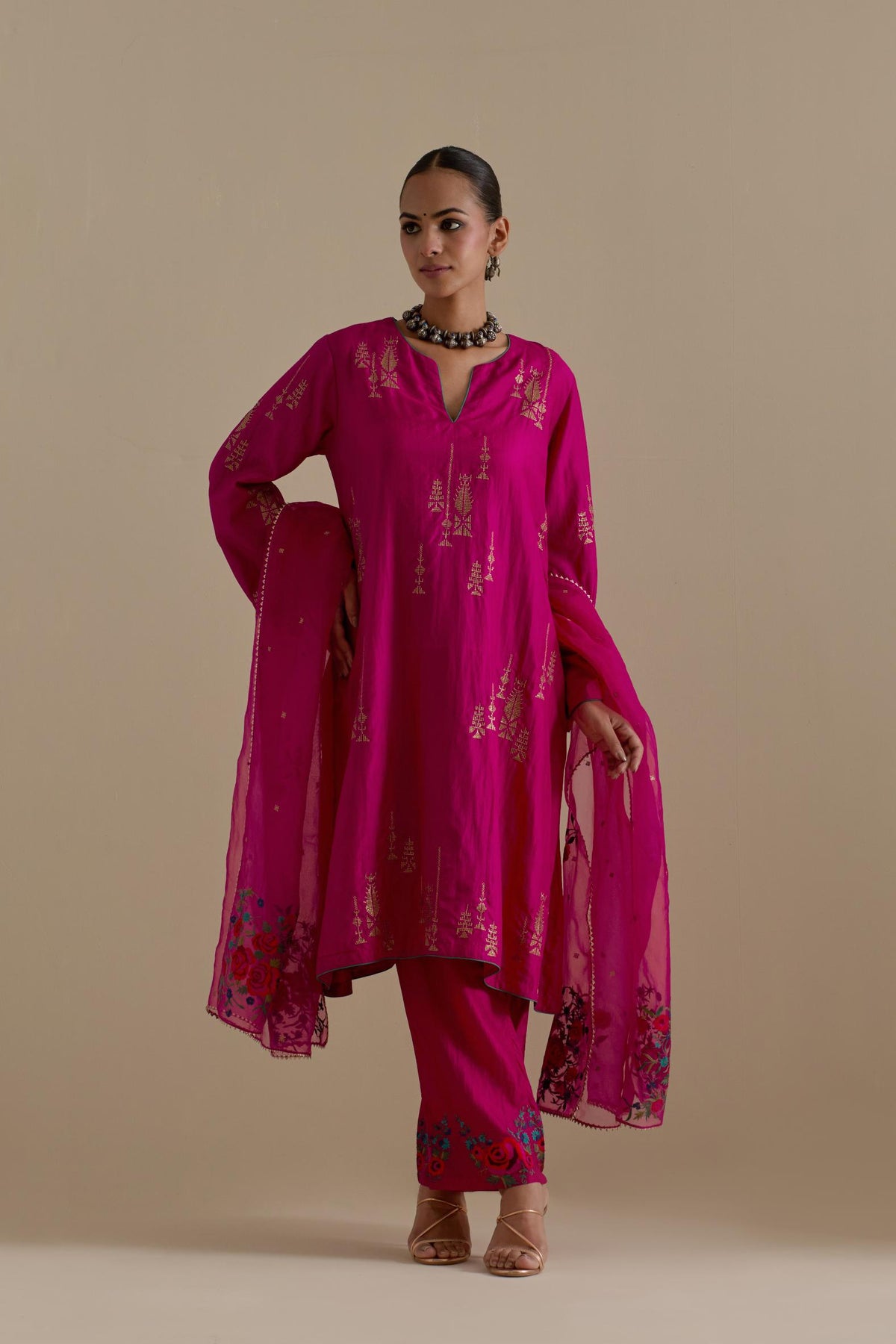 Fuchsia silk A-line short kurta set, highlighted with dull gold zari and sequins handwork.