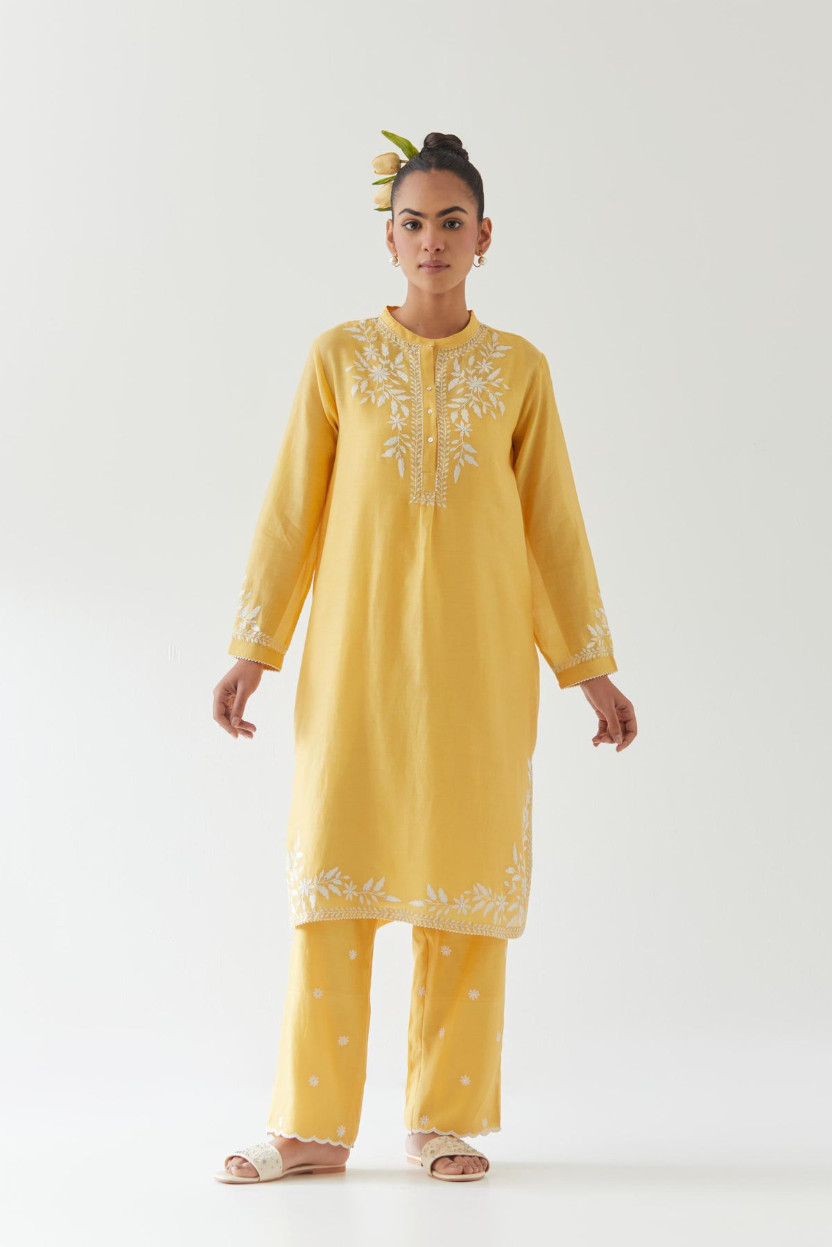 Yellow silk chanderi straight short kurta set with off white thread embroidery.