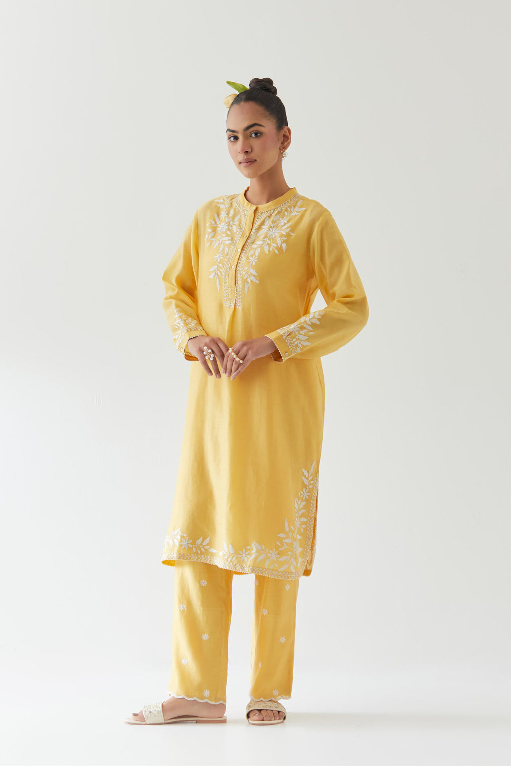 Yellow silk chanderi straight short kurta set with off white thread embroidery.