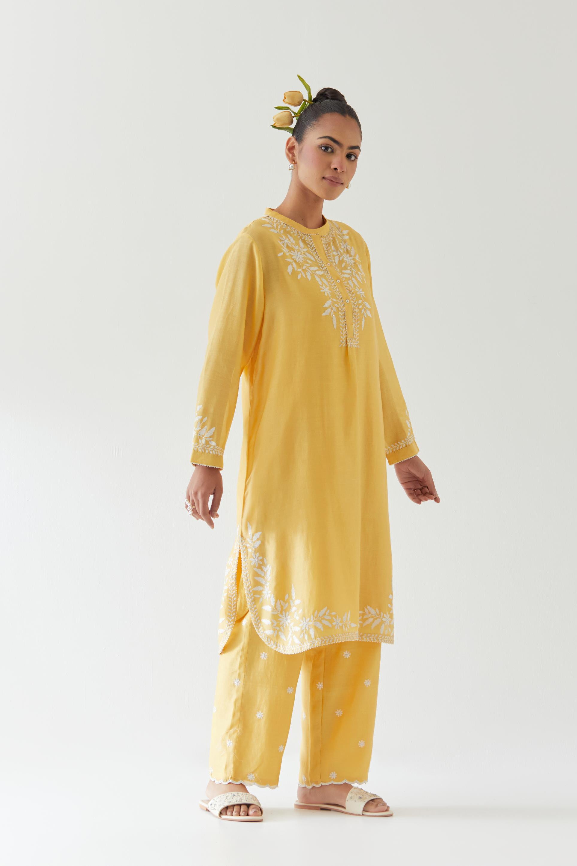 Yellow silk chanderi straight short kurta set with off white thread embroidery.