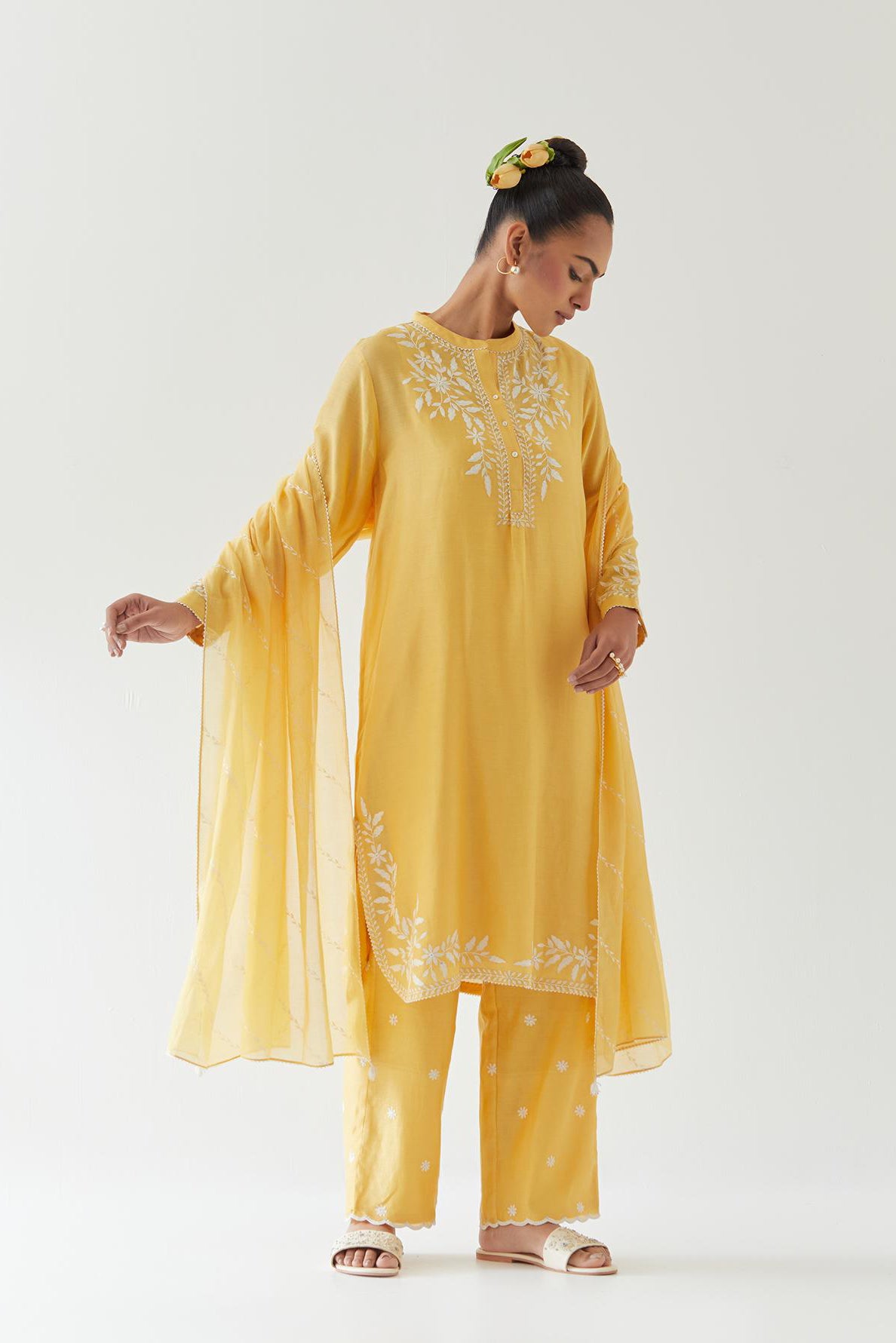 Yellow silk chanderi straight short kurta set with off white thread embroidery.