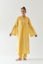 Yellow silk chanderi straight kurta set with long bell sleeves, highlighted with off white thread embroidery.