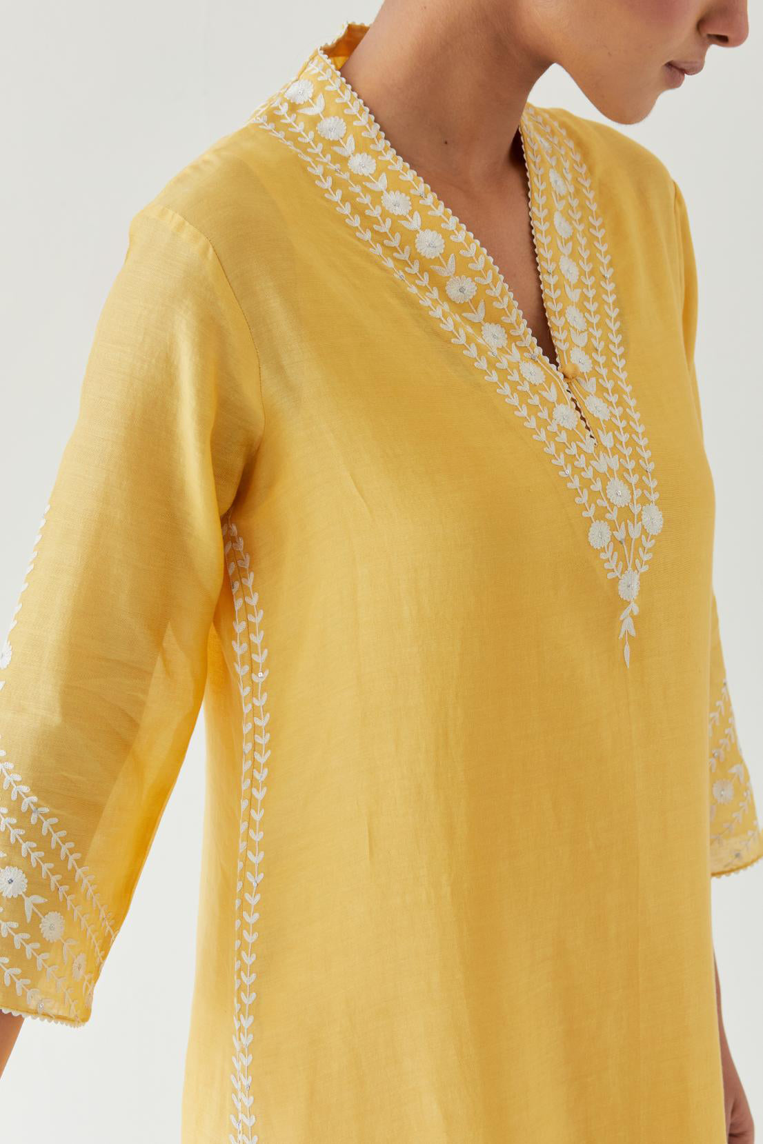 Yellow silk chanderi long straight kurta set highlighted with off white thread embroidery