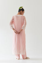 Pink silk chanderi straight kurta set highlighted with off white thread embroidery.