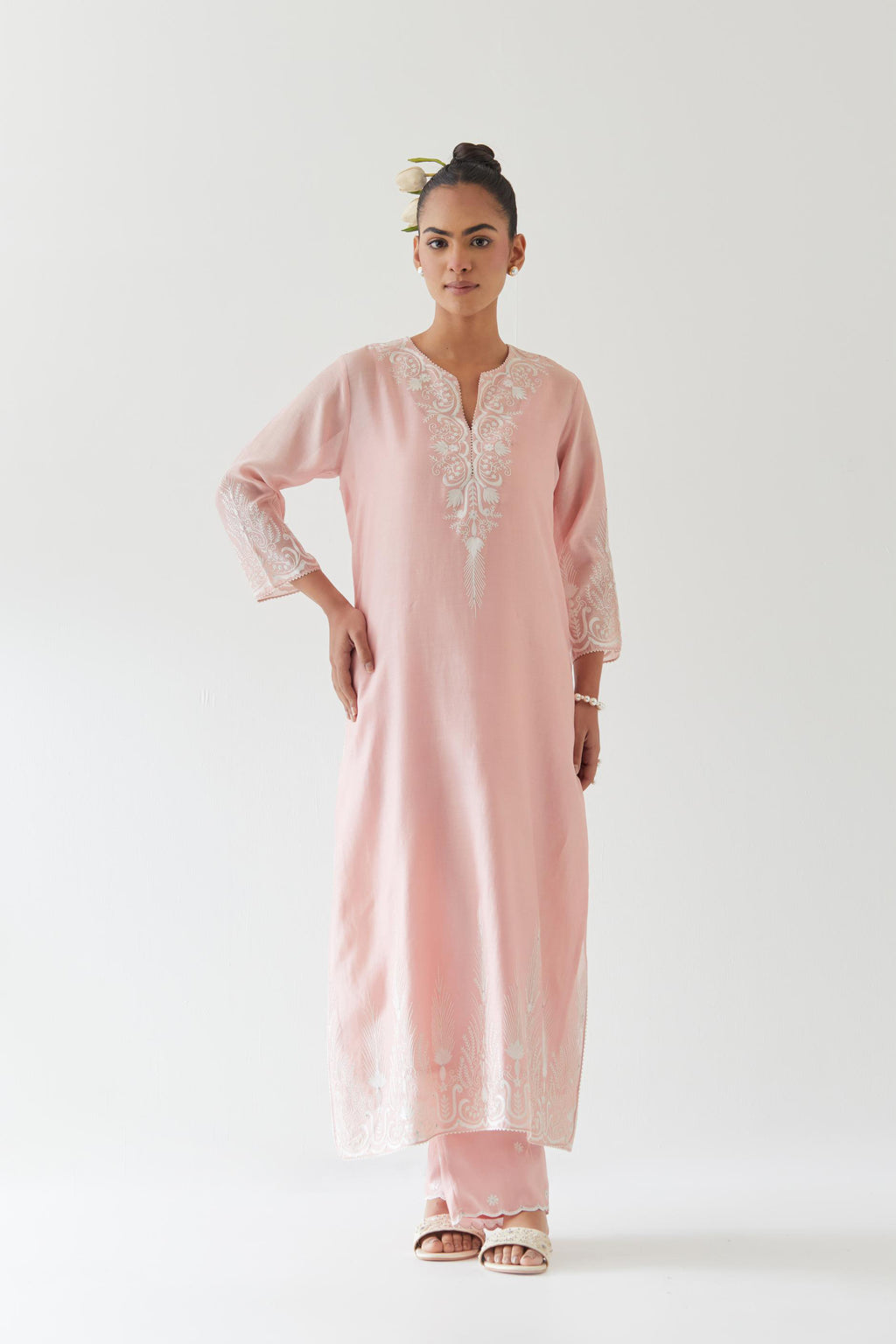 Pink silk chanderi straight kurta set highlighted with off white thread embroidery.