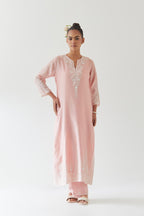 Pink silk chanderi straight kurta set highlighted with off white thread embroidery.