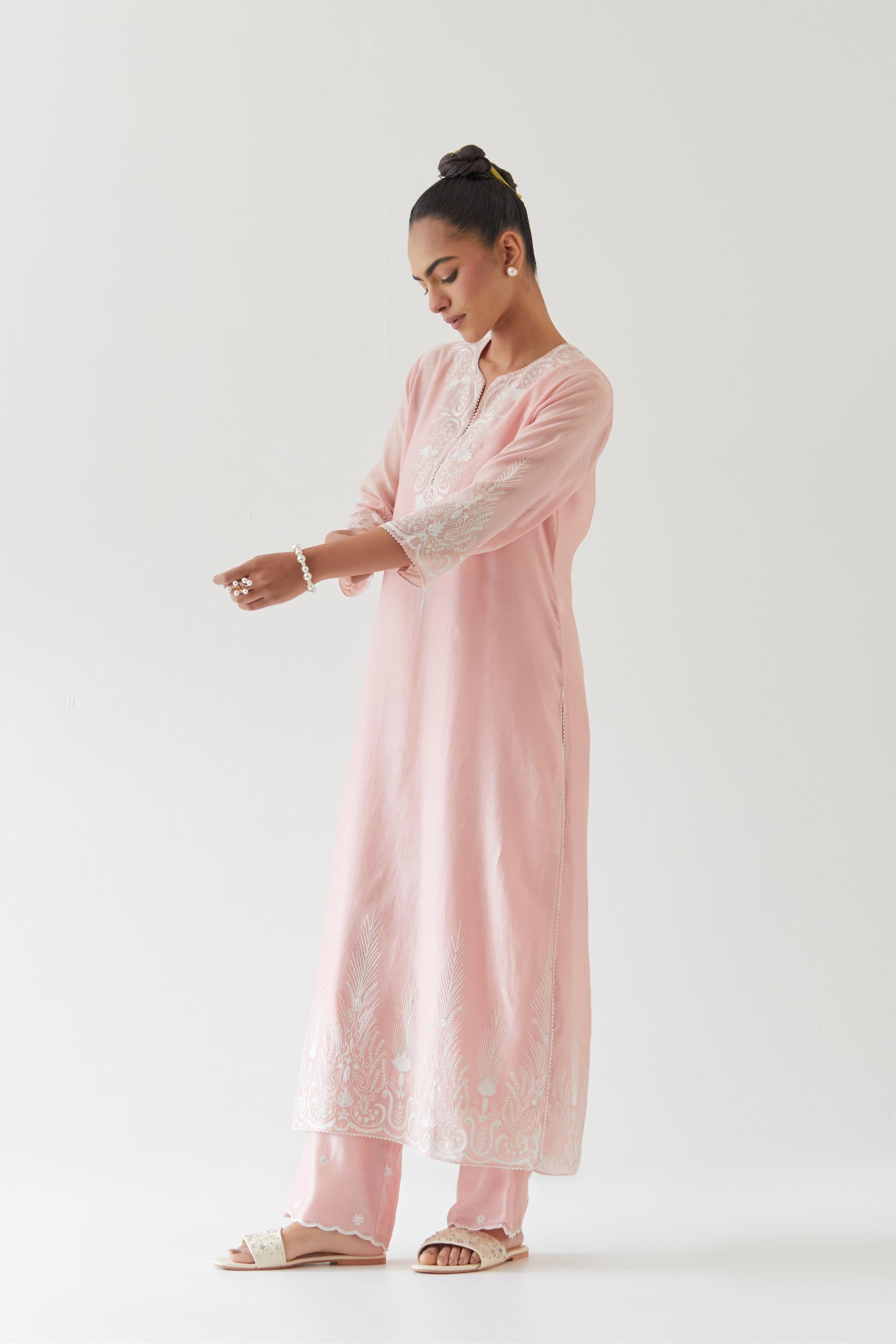 Pink silk chanderi straight kurta set highlighted with off white thread embroidery.