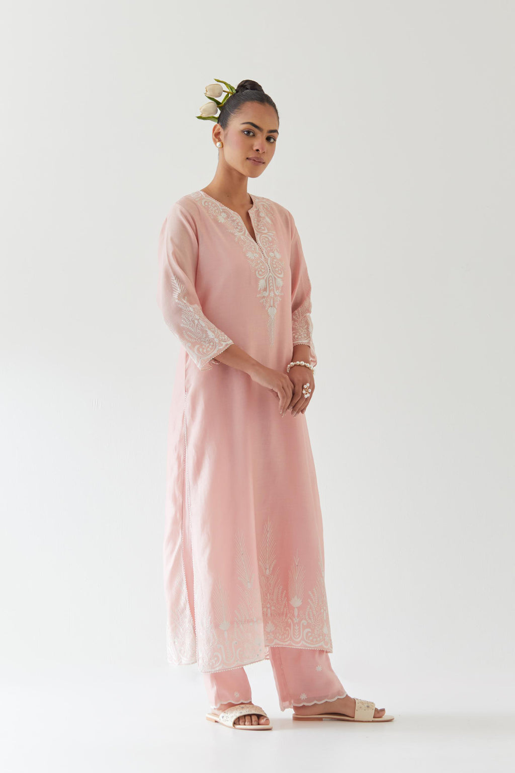 Pink silk chanderi straight kurta set highlighted with off white thread embroidery.