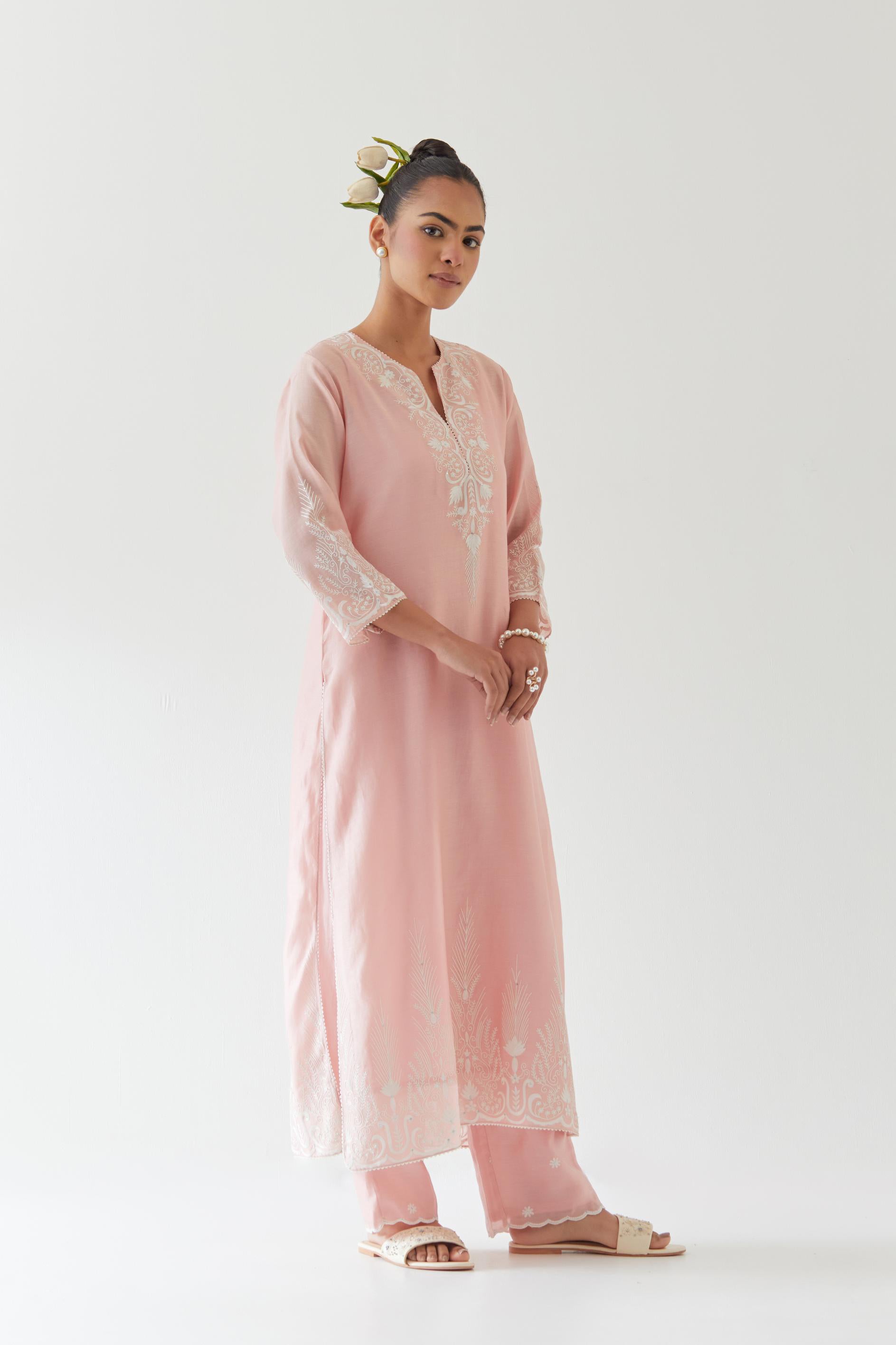 Pink silk chanderi straight kurta set highlighted with off white thread embroidery.