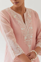 Pink silk chanderi straight kurta set highlighted with off white thread embroidery.