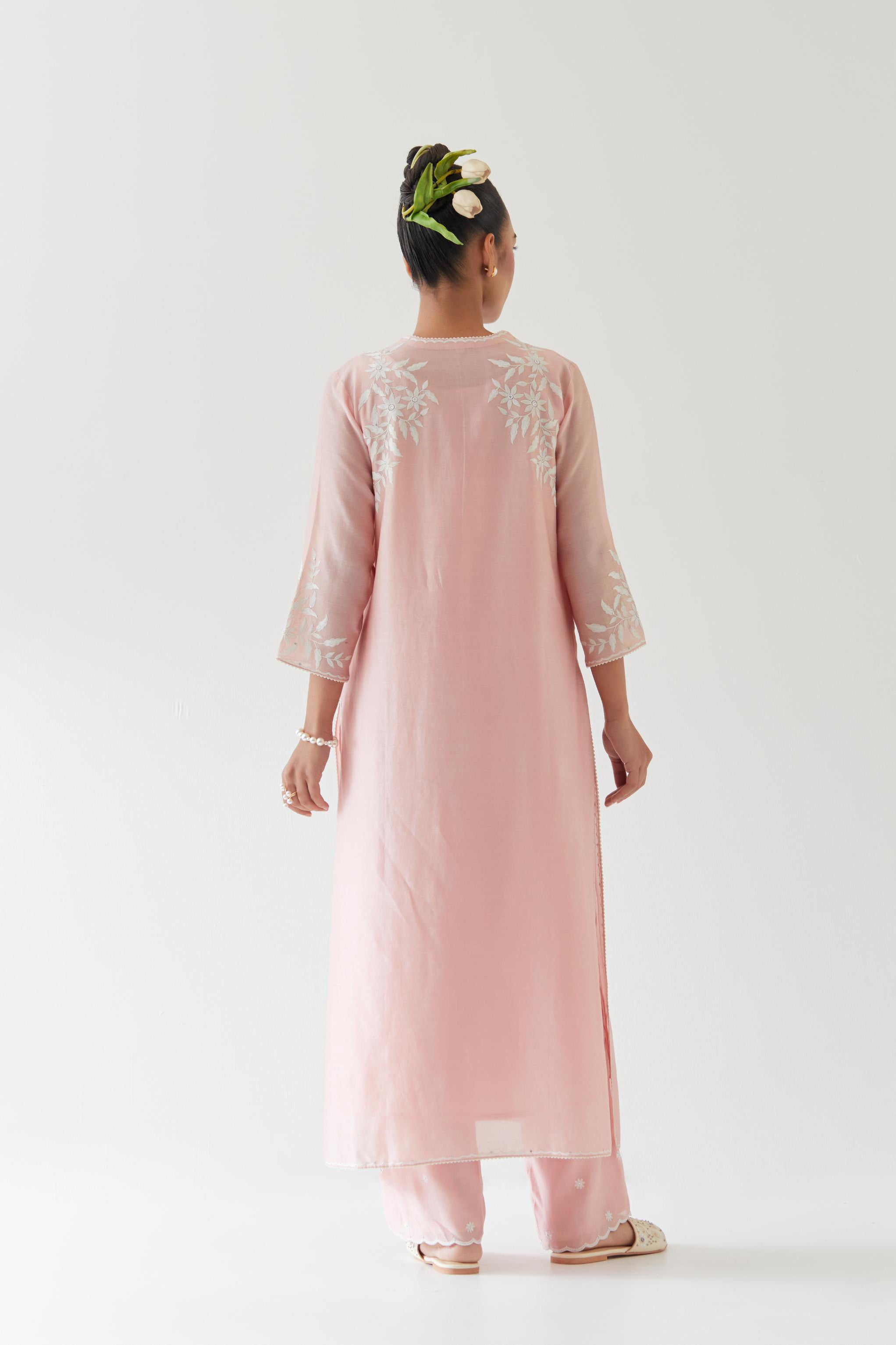 Pink silk chanderi straight kurta set highlighted with off white thread embroidery.