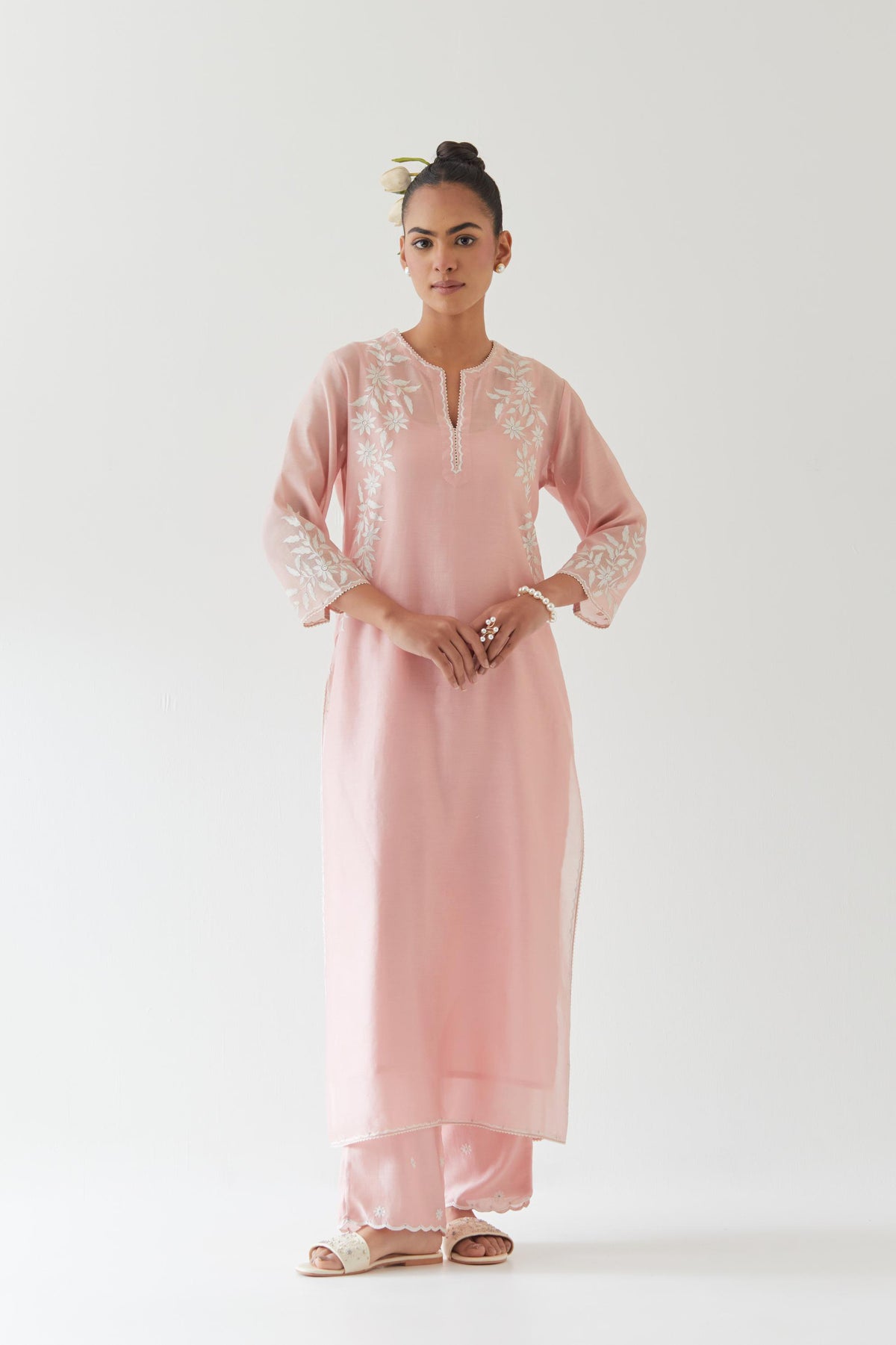 Pink silk chanderi straight kurta set highlighted with off white thread embroidery.