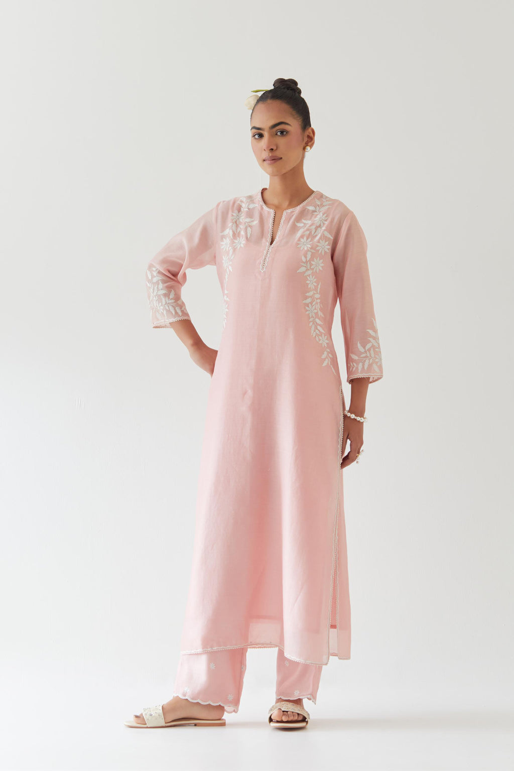 Pink silk chanderi straight kurta set highlighted with off white thread embroidery.