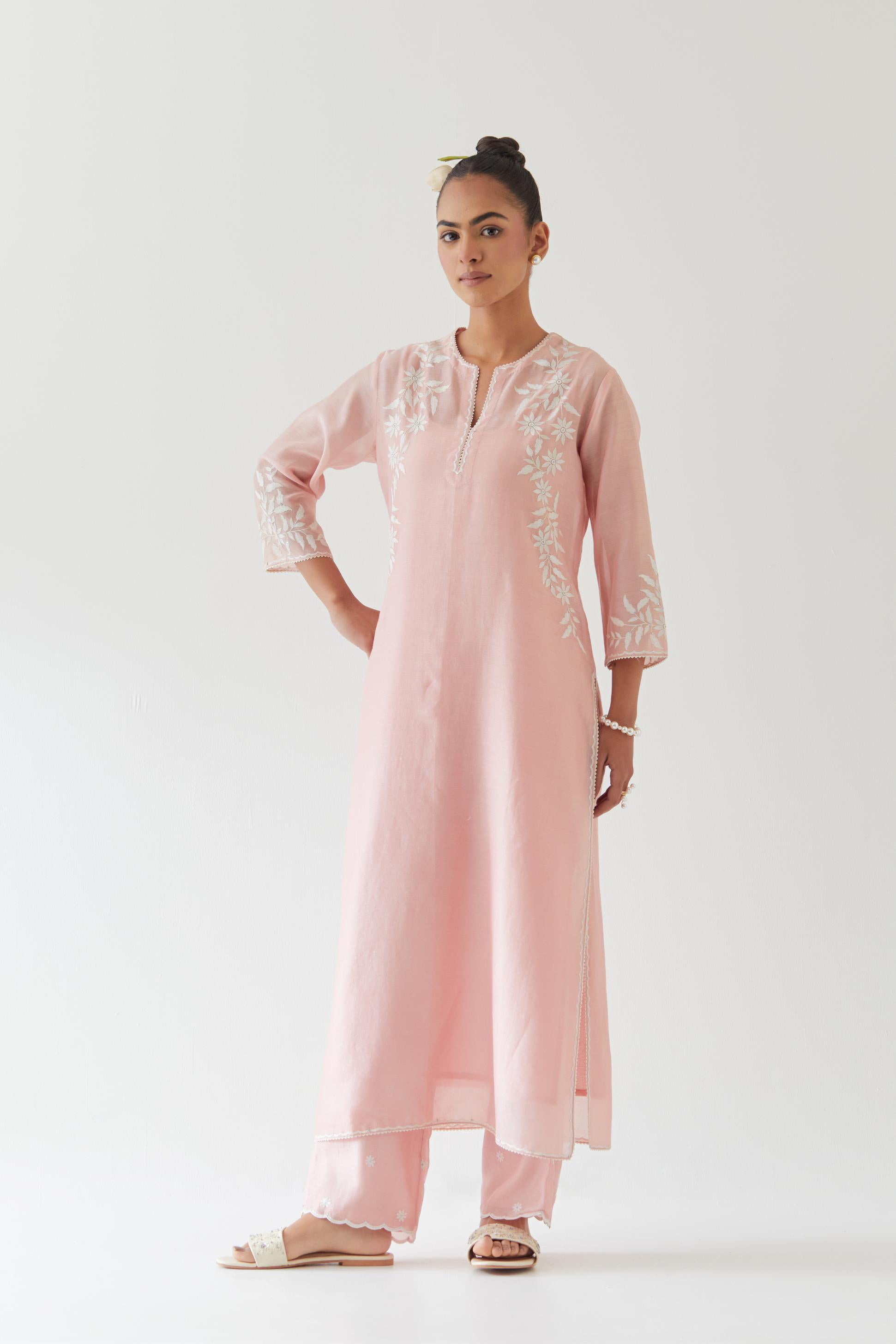 Pink silk chanderi straight kurta set highlighted with off white thread embroidery.