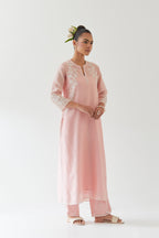 Pink silk chanderi straight kurta set highlighted with off white thread embroidery.
