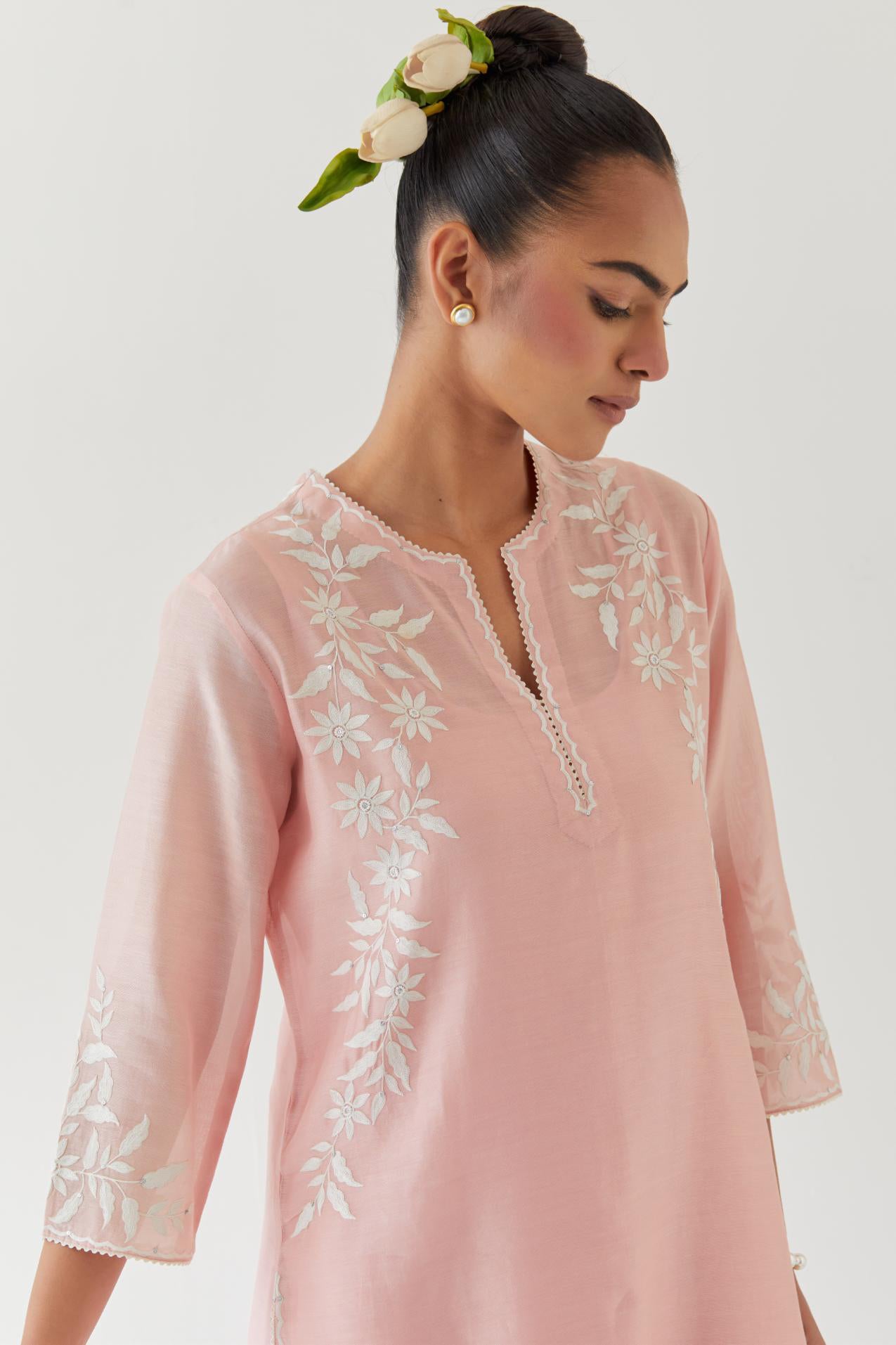Pink silk chanderi straight kurta set highlighted with off white thread embroidery.