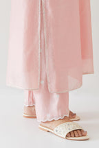 Pink silk chanderi straight kurta set highlighted with off white thread embroidery.