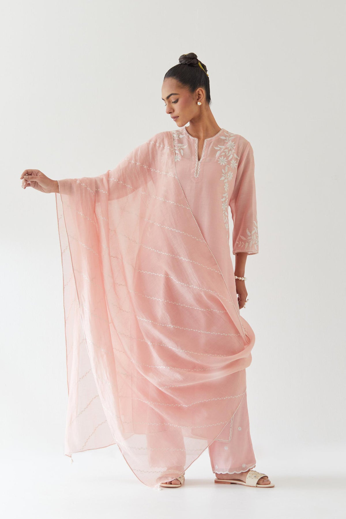 Pink silk chanderi straight kurta set highlighted with off white thread embroidery.