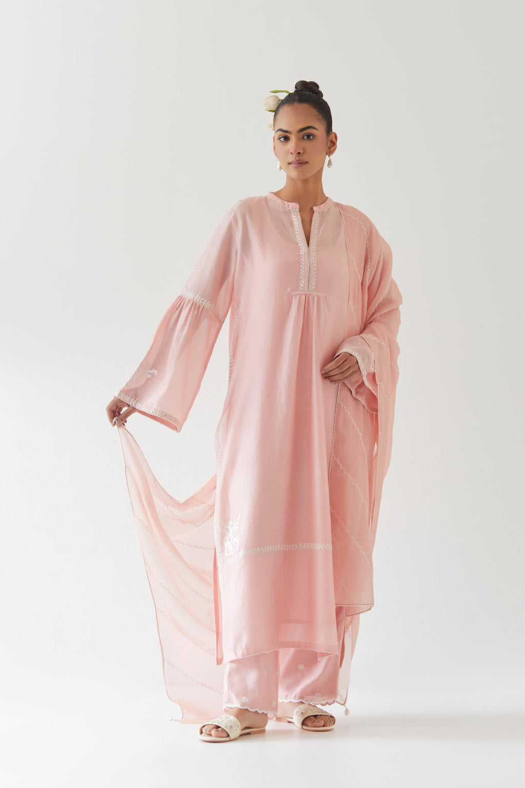 Pink silk chanderi straight kurta set with long bell sleeves, highlighted with off white thread embroidery.