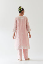 Pink silk chanderi short A-line kurta set highlighted with off white thread embroidery.