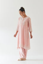 Pink silk chanderi short A-line kurta set highlighted with off white thread embroidery.