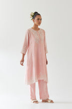 Pink silk chanderi short A-line kurta set highlighted with off white thread embroidery.