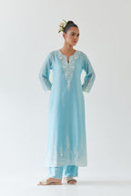 Blue silk chanderi straight kurta set highlighted with off white thread embroidery.
