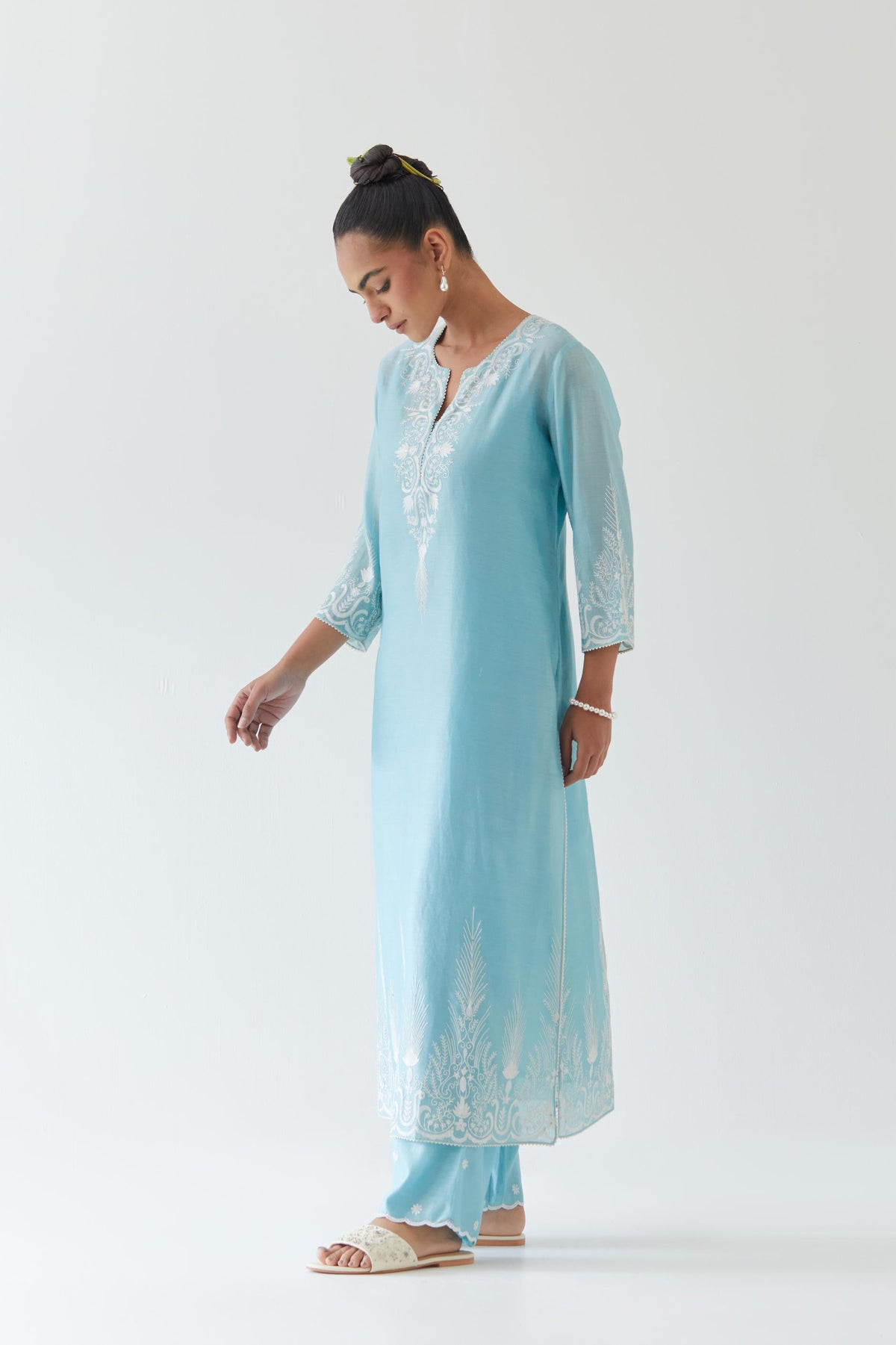 Blue silk chanderi straight kurta set highlighted with off white thread embroidery.