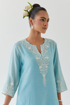 Blue silk chanderi straight kurta set highlighted with off white thread embroidery.