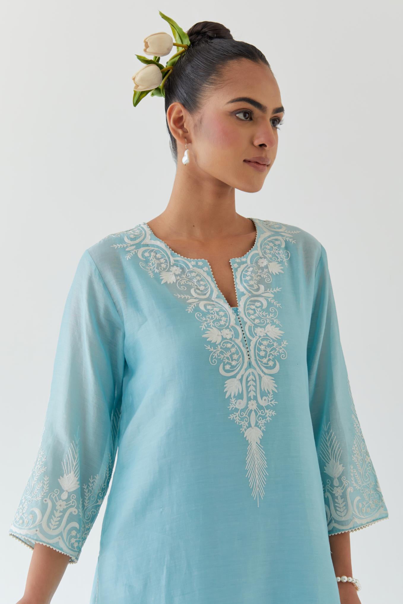 Blue silk chanderi straight kurta set highlighted with off white thread embroidery.