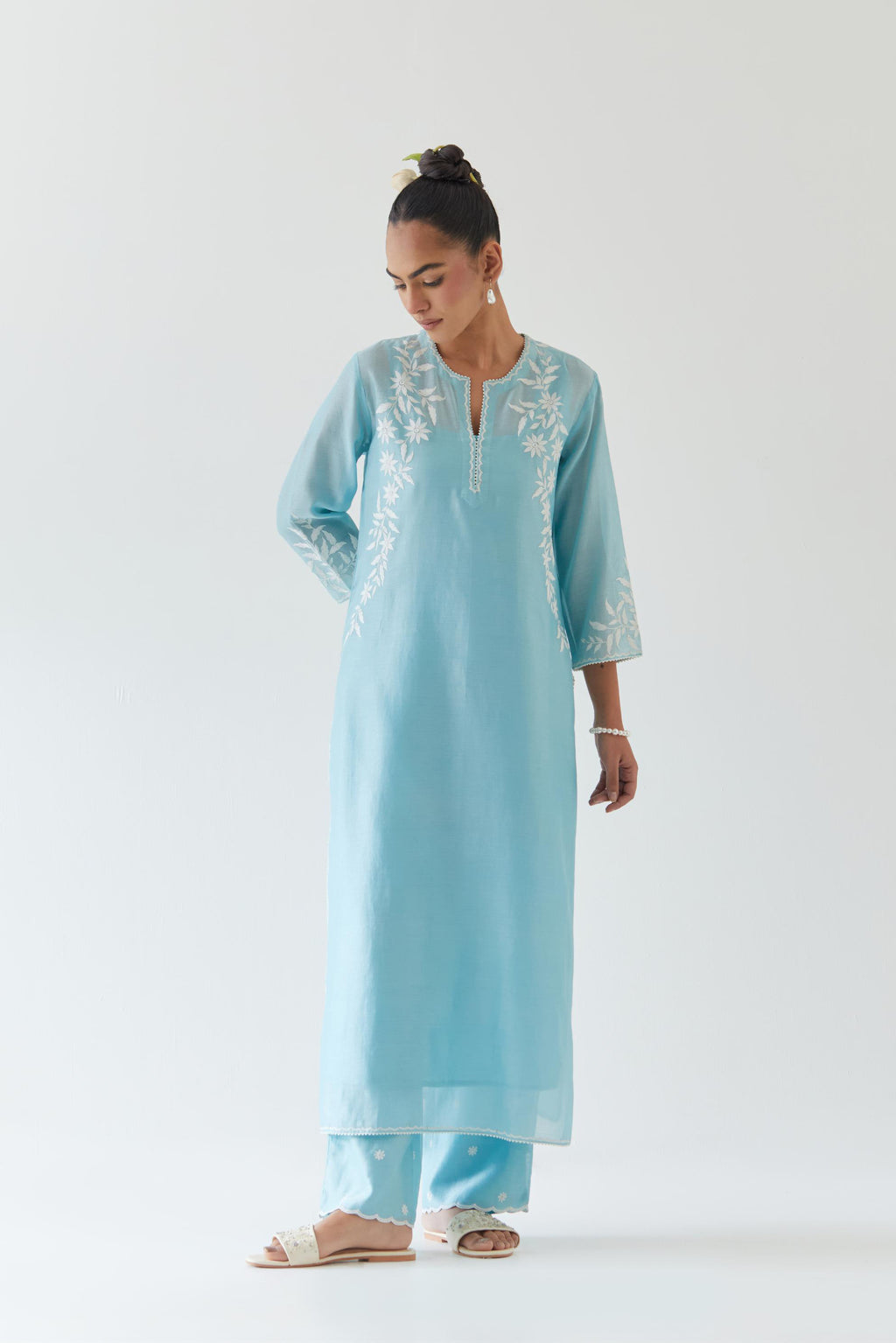 Blue silk chanderi straight kurta set highlighted with off white thread embroidery.