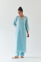 Blue silk chanderi straight kurta set highlighted with off white thread embroidery.
