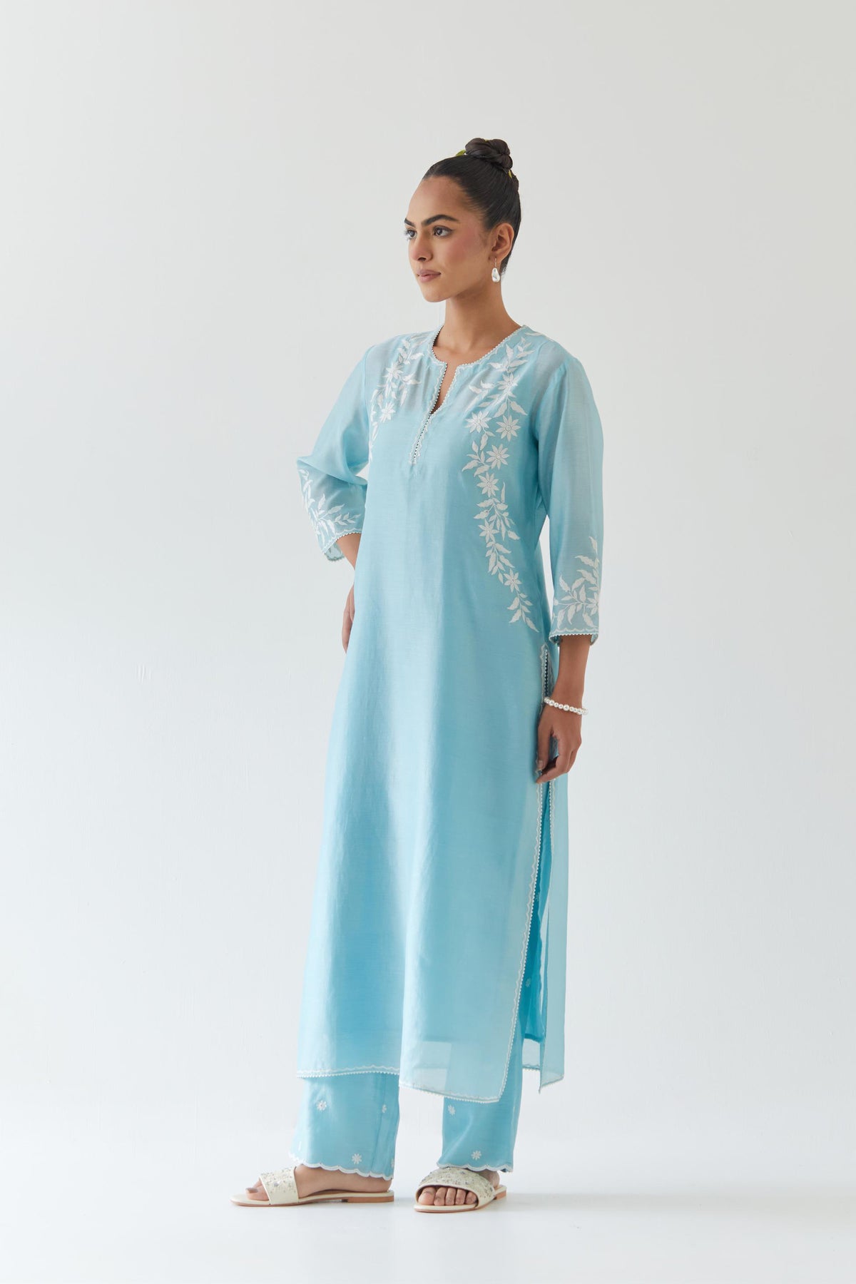 Blue silk chanderi straight kurta set highlighted with off white thread embroidery.
