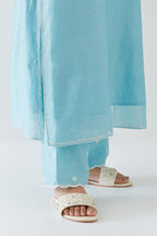 Blue silk chanderi straight kurta set highlighted with off white thread embroidery.