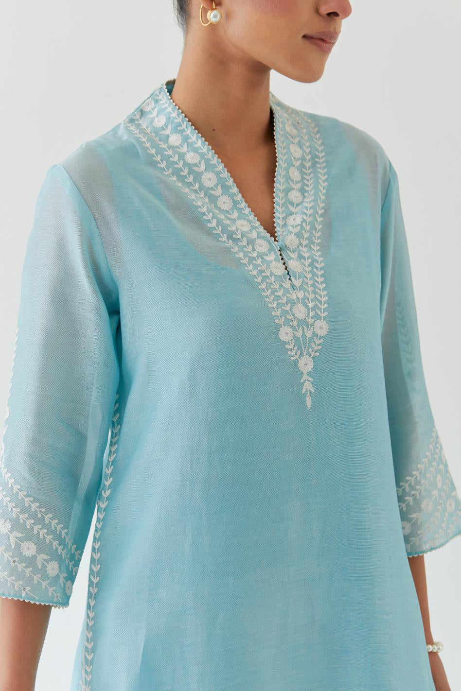 Blue silk chanderi long straight kurta set highlighted with off white thread embroidery