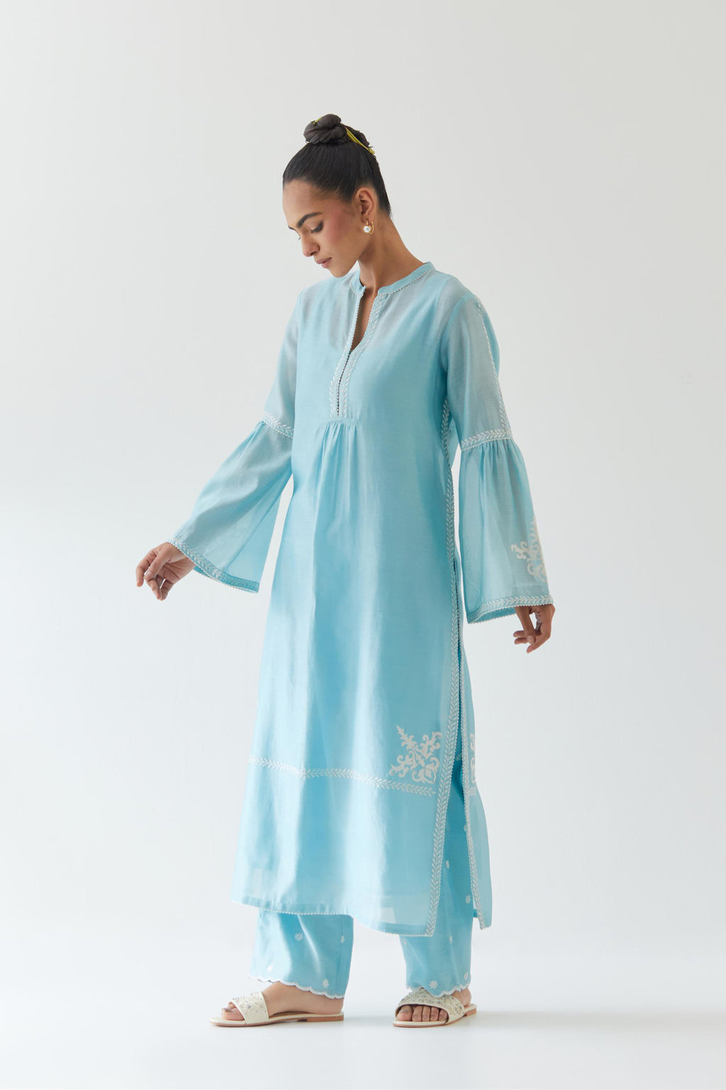 Blue silk chanderi straight kurta set with long bell sleeves, highlighted with off white thread embroidery.