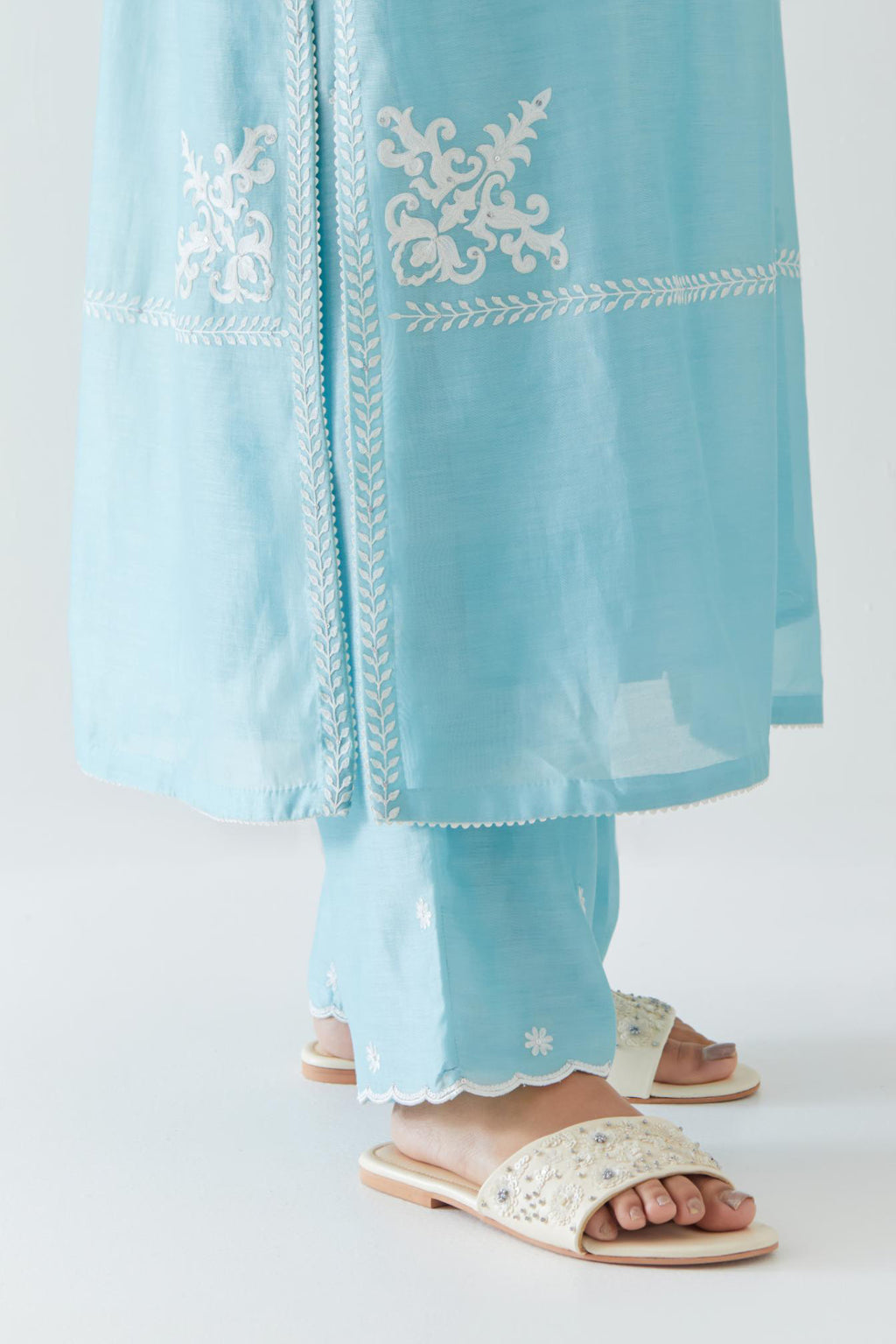 Blue silk chanderi straight kurta set with long bell sleeves, highlighted with off white thread embroidery.