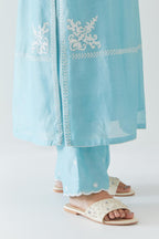 Blue silk chanderi straight kurta set with long bell sleeves, highlighted with off white thread embroidery.