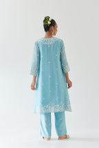 Blue silk chanderi short A-line kurta set highlighted with off white thread embroidery.