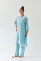 Blue silk chanderi short A-line kurta set highlighted with off white thread embroidery.